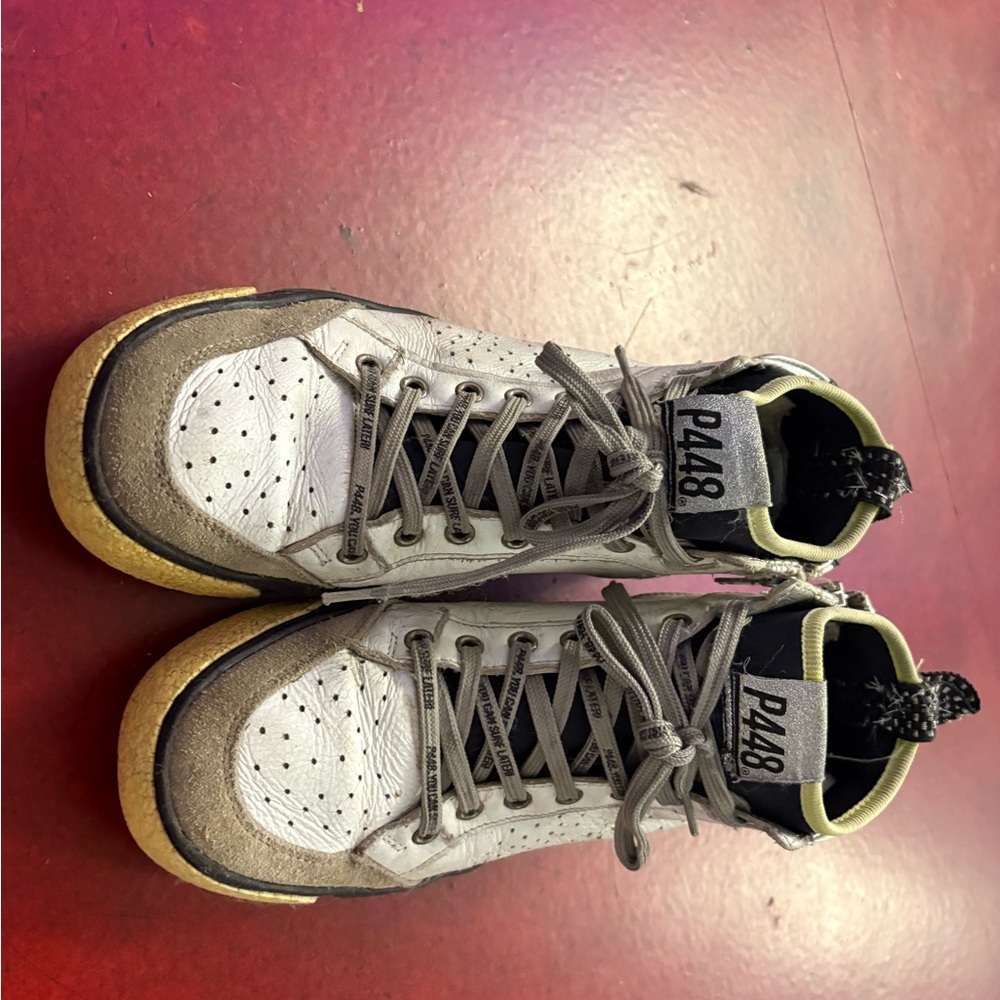 P448 White and Gray High-Top with Yellow Trim originally owned by Cara Delevinge